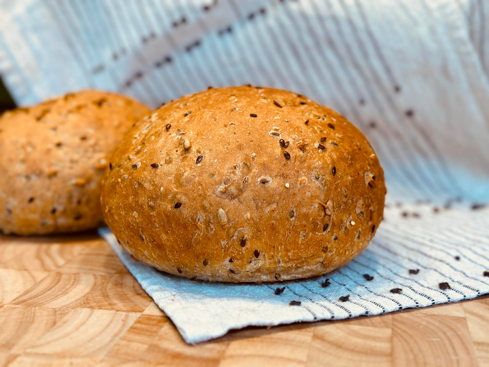 Molibake 8 Grain Bread Mix seeds closeup highlights flax, sesame, and millet texture.