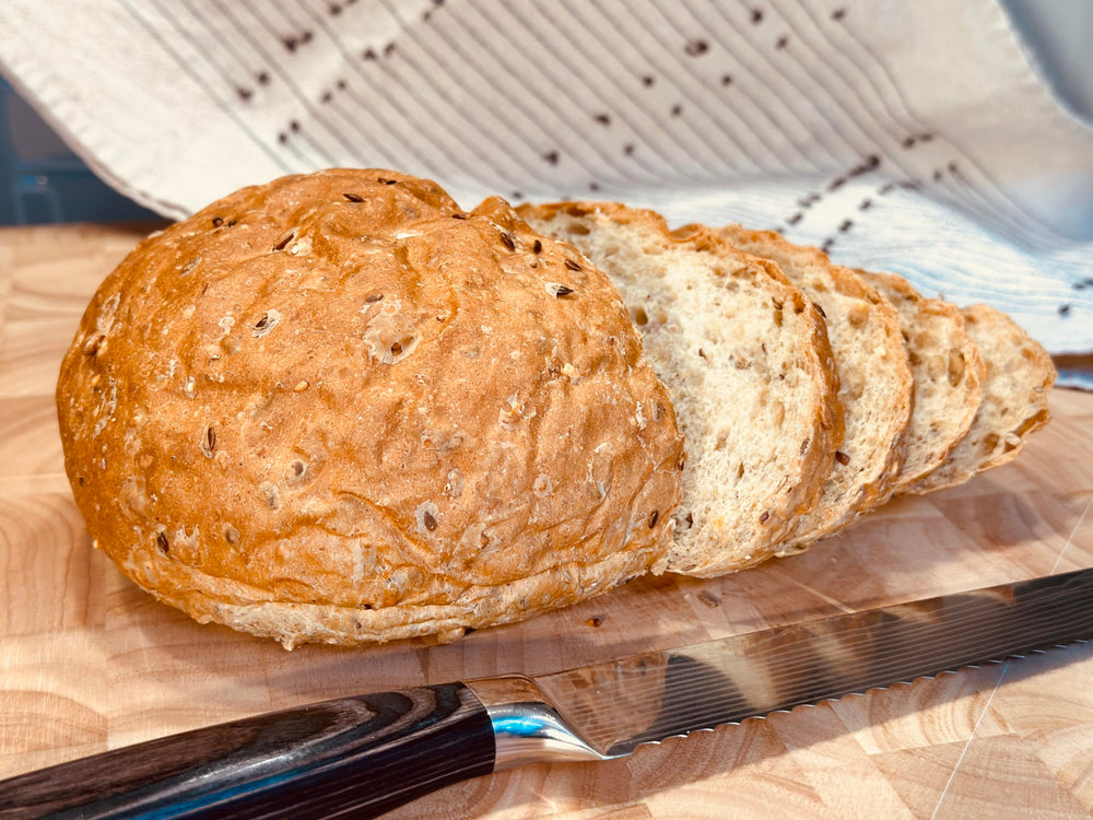Molibake 8 Grain Bread Mix sliced loaf emphasizes fresh, wholesome slice for sandwiches.
