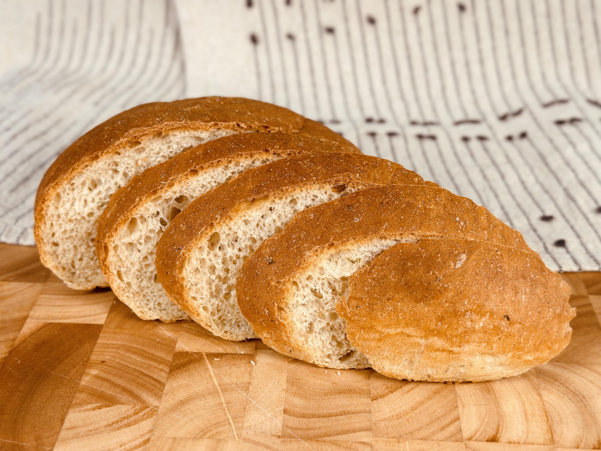 Fresh Molibake potato bread loaf cooling after baking in the oven