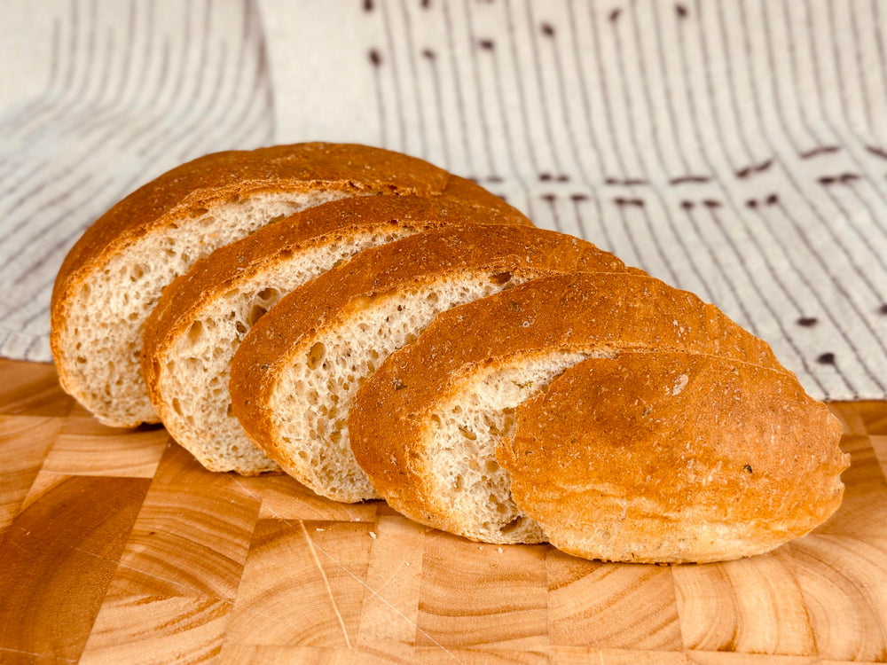 Fresh Molibake potato bread loaf cooling after baking in the oven