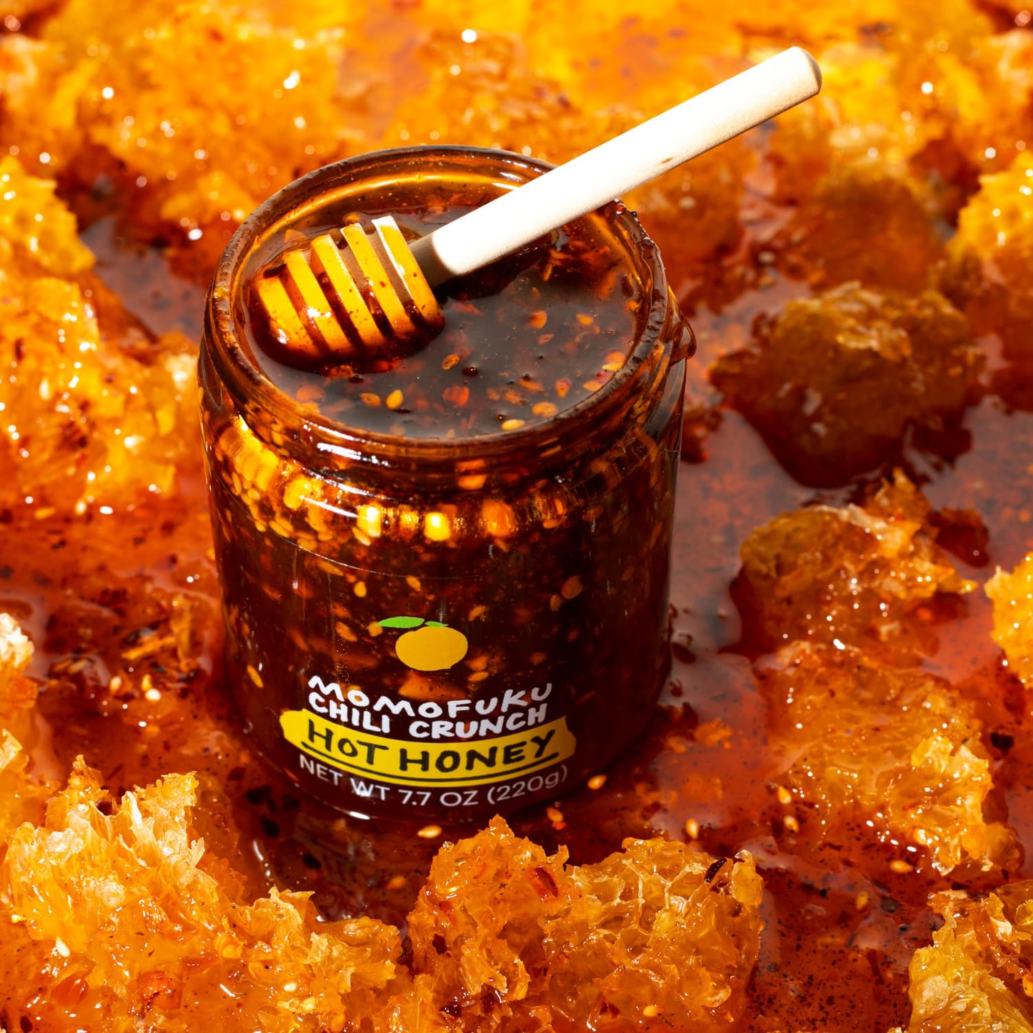 Momofuku Hot Honey Chili Crunch jar being used with roasted meats for glaze