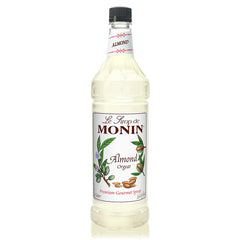 Monin Almond Syrup bottle pour with rich nutty notes for coffee