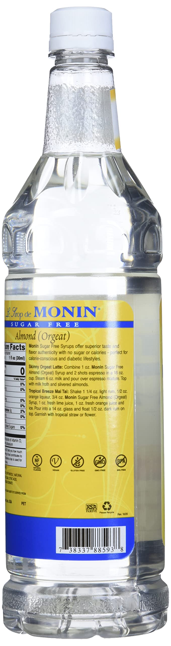 Glass with cocktail garnishes and Monin Almond Syrup for balanced flavor.