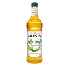 Monin Banana Syrup bottle delivers ripe banana flavor for cocktails and desserts.