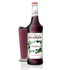 Monin Blackberry Syrup bottle showcases deep purple color, ideal for cocktails.