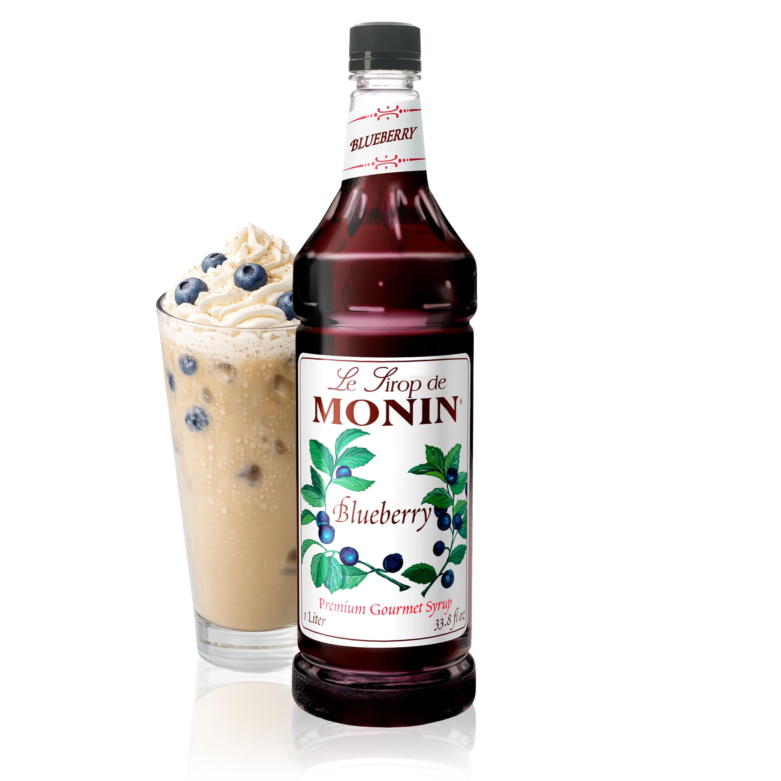 Monin Blueberry Syrup bottle pour adds fruity flavor to drinks.