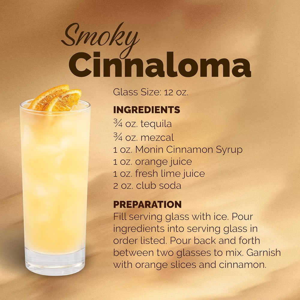 Monin Cinnamon Syrup in a cocktail glass suggests versatile spice.