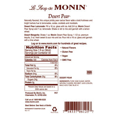 Pouring Monin Desert Pear Syrup into a glass for refreshing drinks