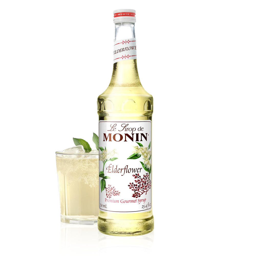 Monin Elderflower Syrup bottle label close-up, highlighting premium floral aroma for cocktails and sodas.
