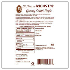 Monin Granny Smith Apple Syrup cocktail glass highlights crisp apple flavor.