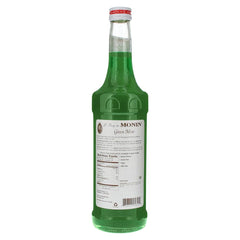 Monin Green Mint Syrup being poured to enhance cocktails and dairy-free beverages
