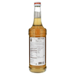 Monin Maple Spice Syrup being poured into a latte for flavor boost