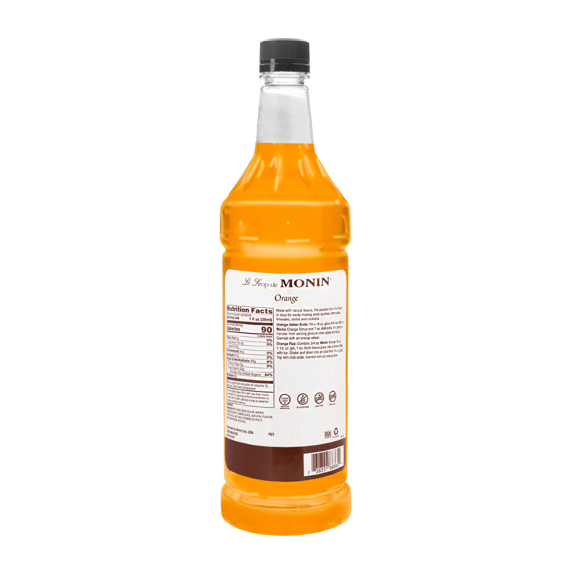 Monin Orange Syrup bottle closeup showcasing rich color.