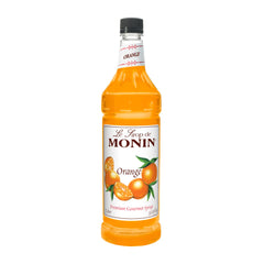 Monin Orange Syrup bottle pour for cocktails and desserts.