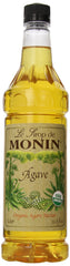 Monin Organic Agave Syrup bottle on a kitchen counter, ideal for versatile beverages