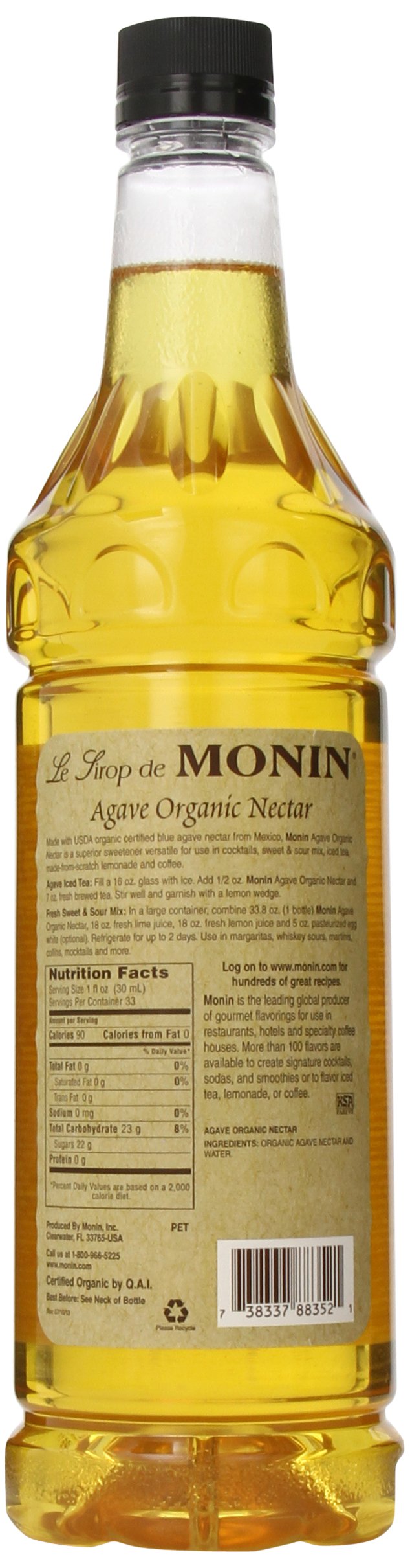 Monin Organic Agave Syrup in a glass with lemon, showcasing natural sweetness
