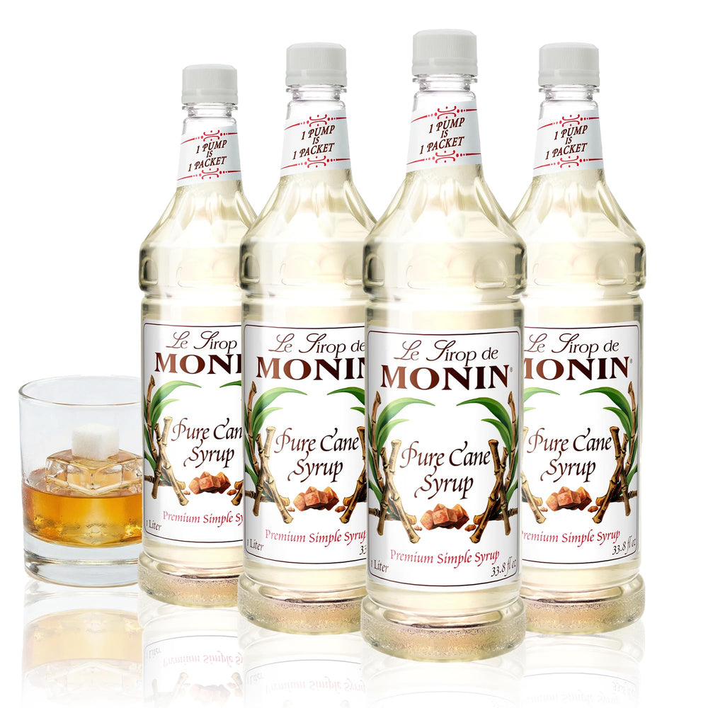 Monin Pure Cane Syrup bottle pouring into coffee for a clean sweetness