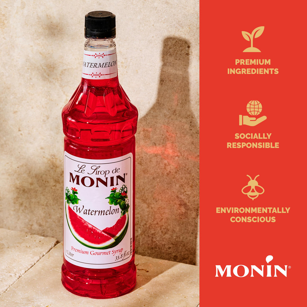 Monin raspberry syrup bottle close-up highlighting fruity tartness for cocktails.
