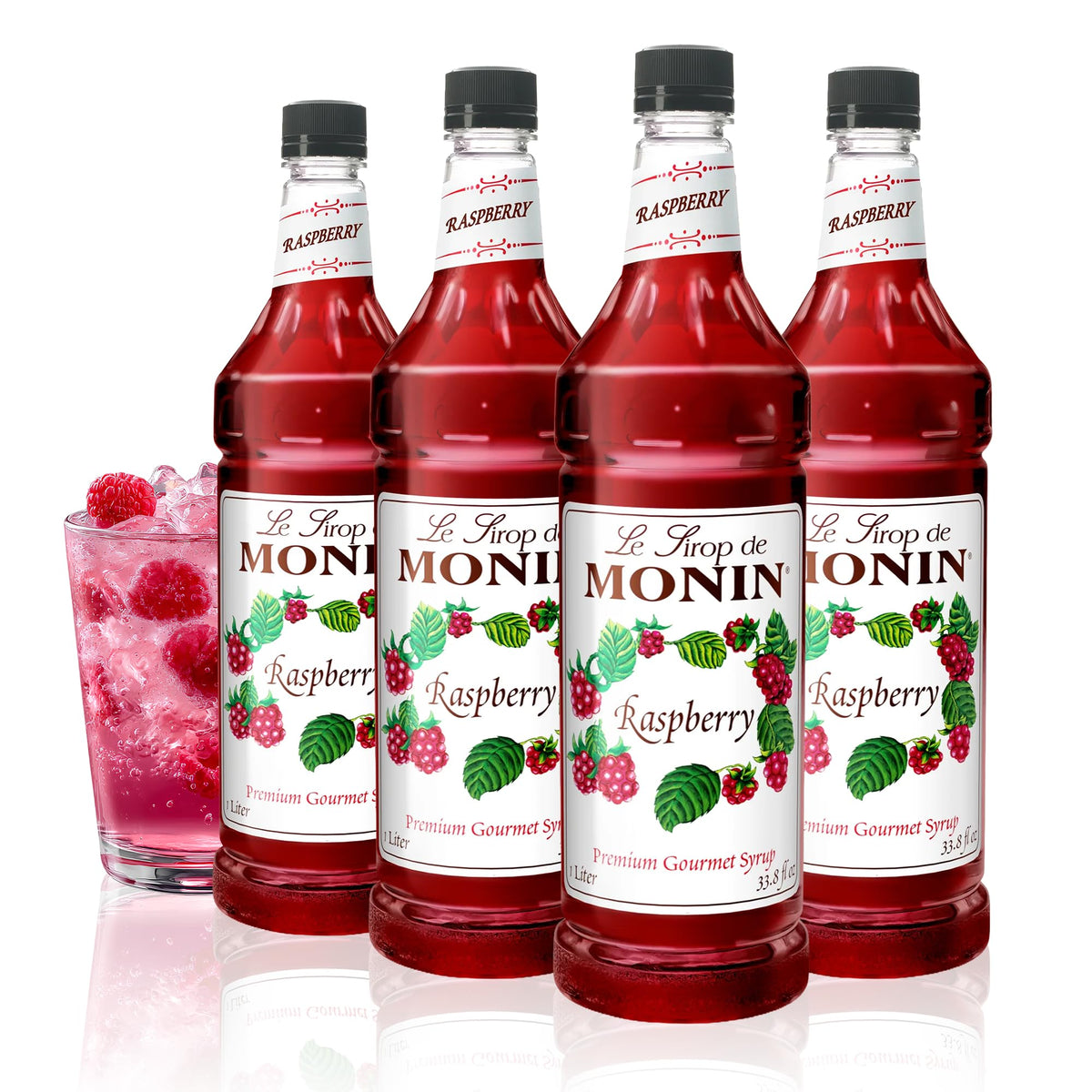 Monin Raspberry Syrup bottle front with vibrant raspberry flavor for cocktails and lemonades.