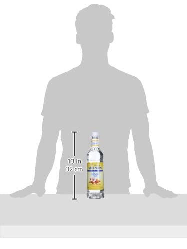 Monin Sugar Free Almond Syrup bottle beside coffee setup for zero-calorie indulgence.