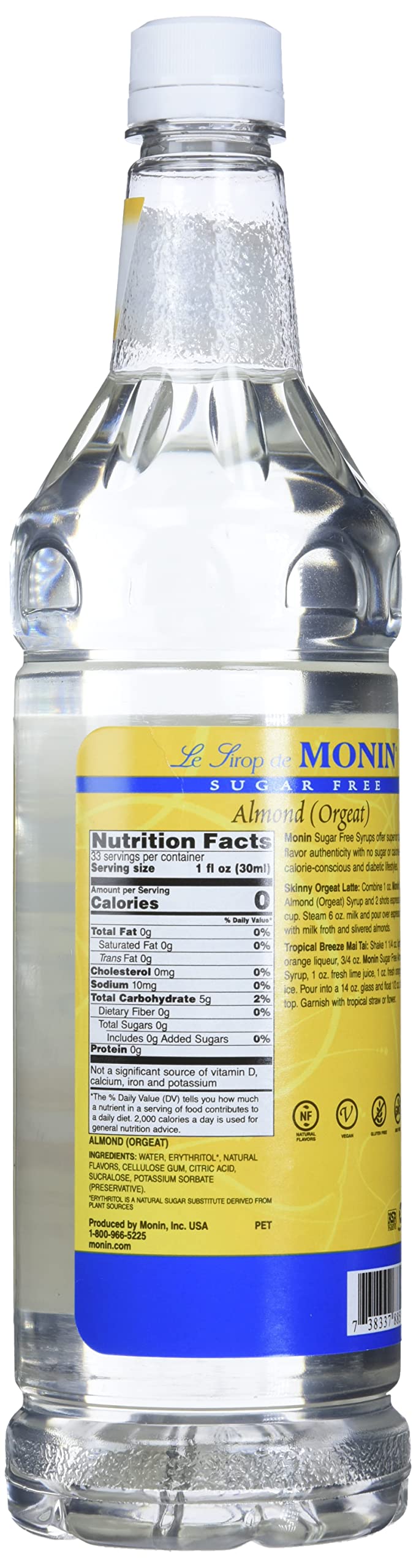 Pouring Monin Sugar Free Almond Syrup to elevate a latte with nutty aroma.