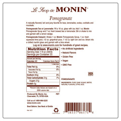 Pouring Monin Sugar Free Pomegranate Syrup into a glass for a refreshing drink.