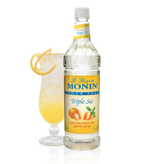 Monin Sugar Free Triple Sec bottle closeup showcasing citrus aroma and zero-calorie versatility.