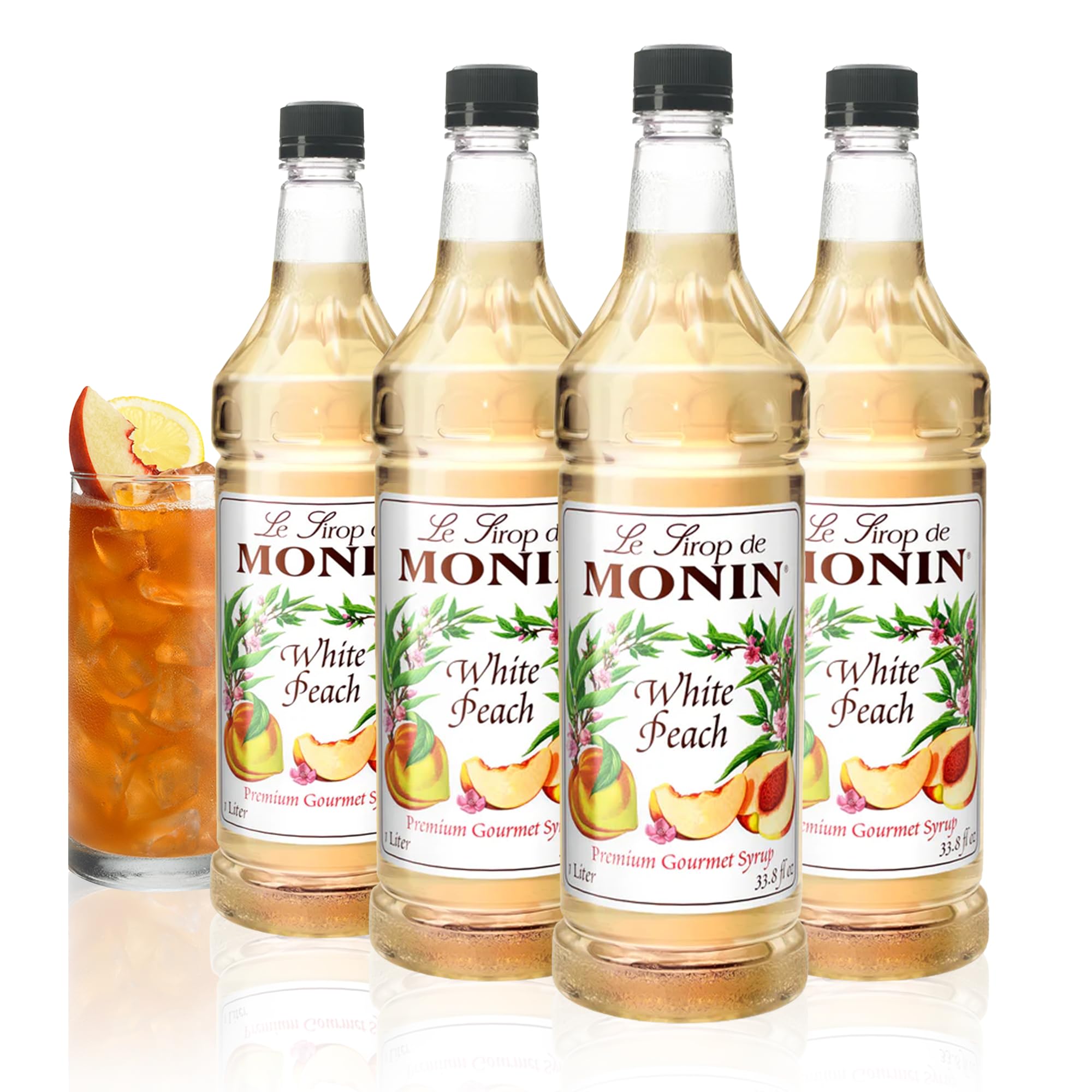 Monin White Peach Syrup bottle, perfect for cocktails and iced teas.