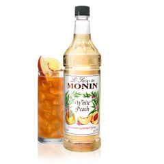 Monin White Peach Syrup bottle ready to elevate cocktails with peach aroma