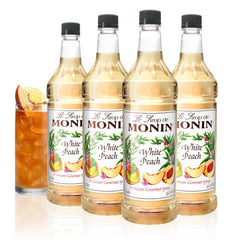 Monin White Peach Syrup bottle, perfect for cocktails and iced teas.