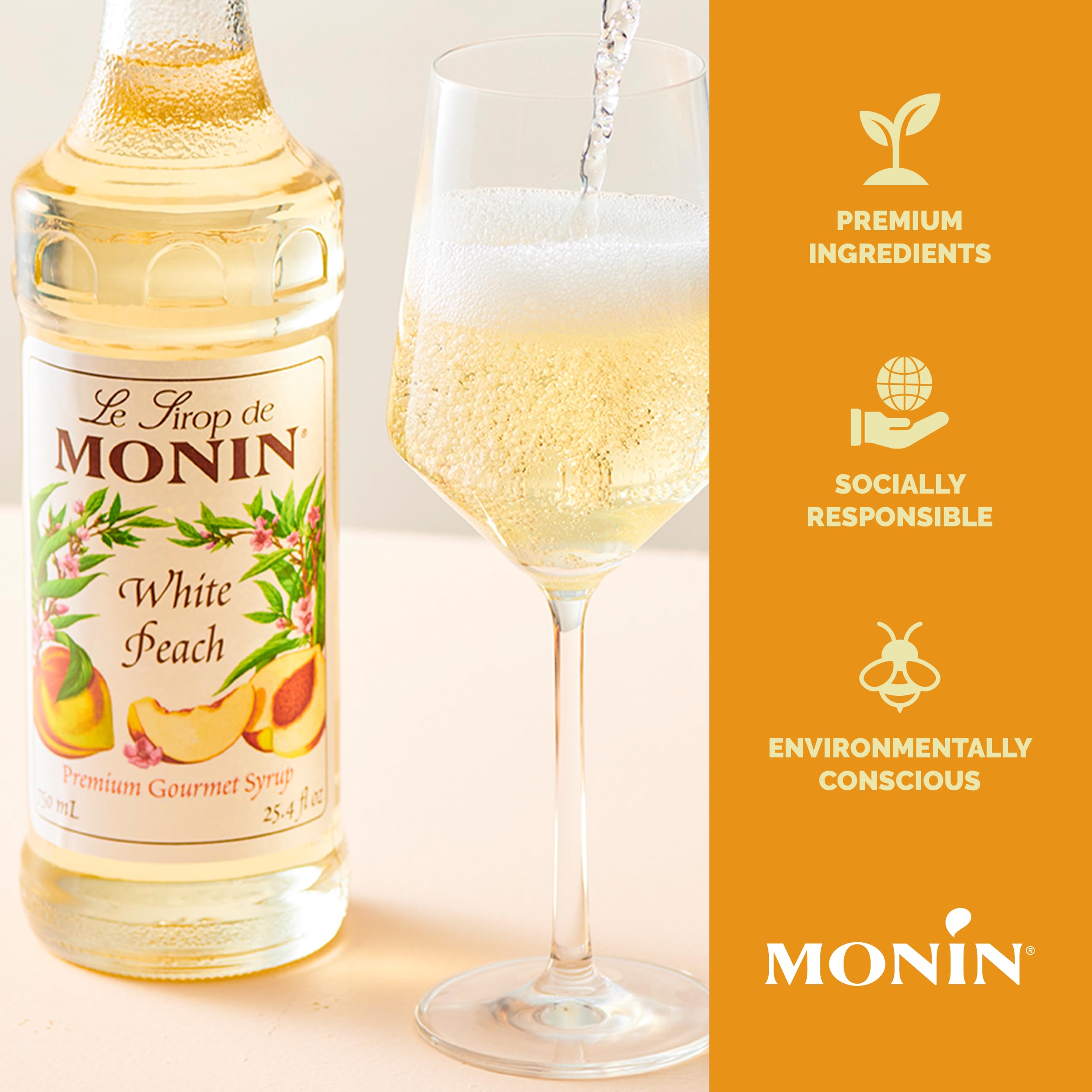 Close-up of Monin White Peach Syrup label highlighting gluten-free and non-GMO.