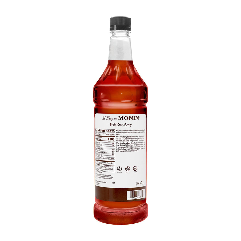 Monin Wild Strawberry Syrup pour delivers vibrant strawberry flavor for smoothies and cocktails.