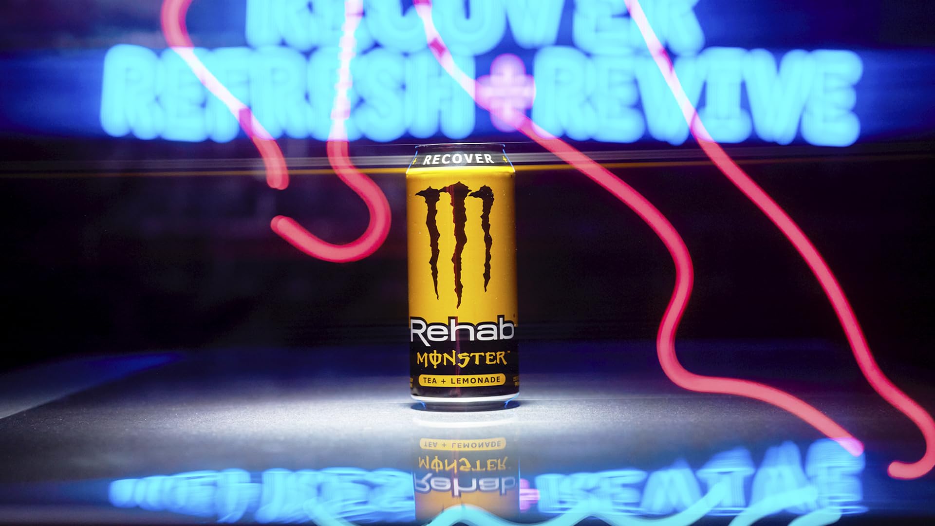 Glass with ice and Monster Rehab Tea Lemonade signals a cool, refreshing pick-me-up.