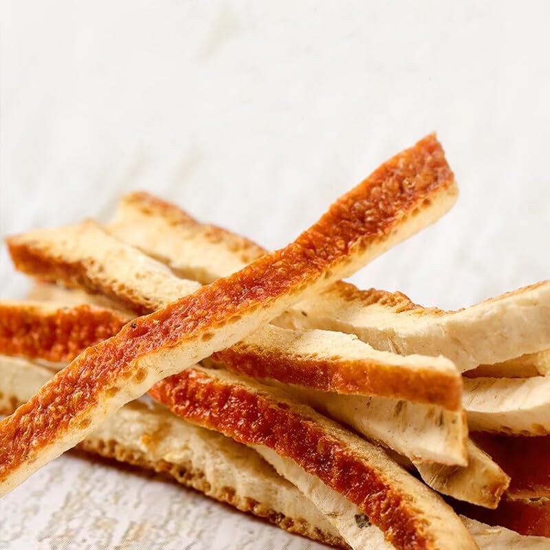 Dried orange peel pieces ready to flavor soups and dishes.