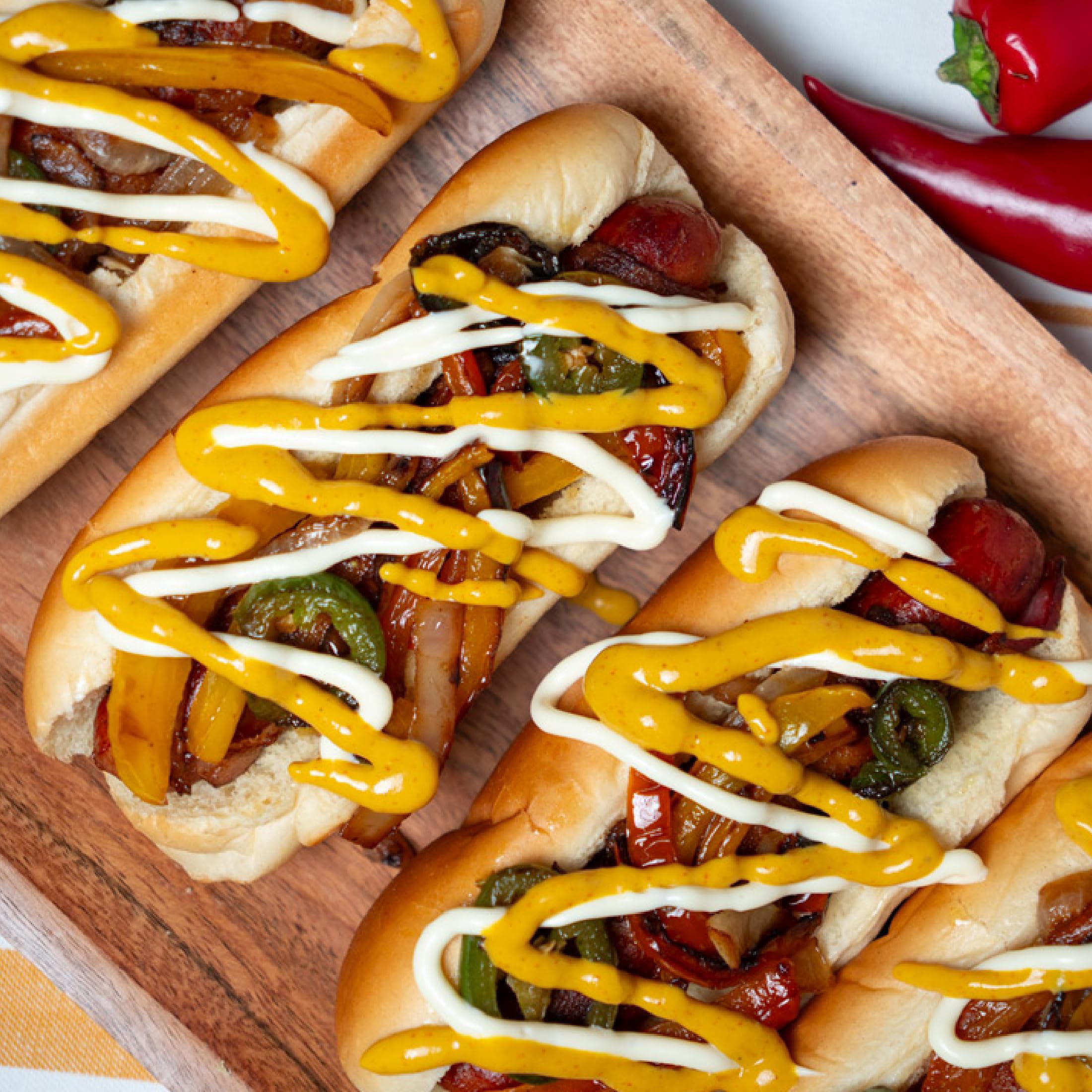 Morehouse Tapatio spicy yellow mustard on a burger delivering a spicy kick