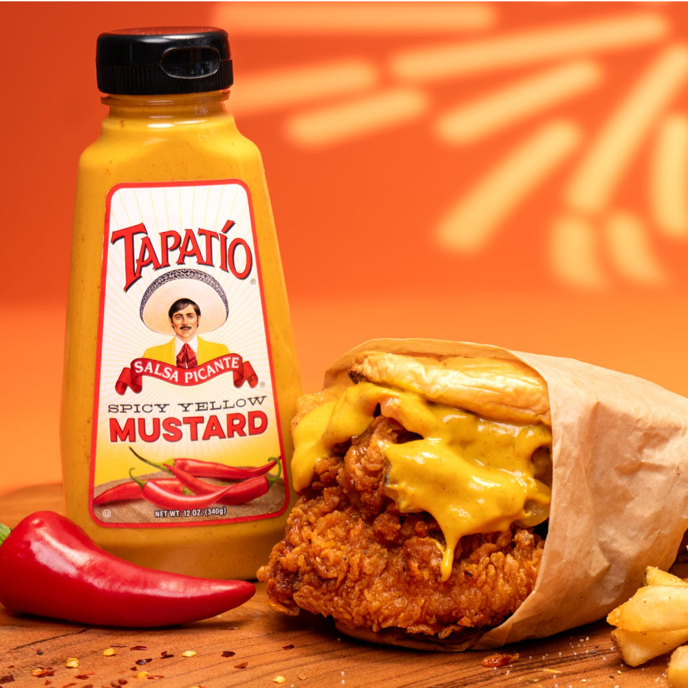 Morehouse Tapatio spicy yellow mustard spread on a sandwich with tangy heat