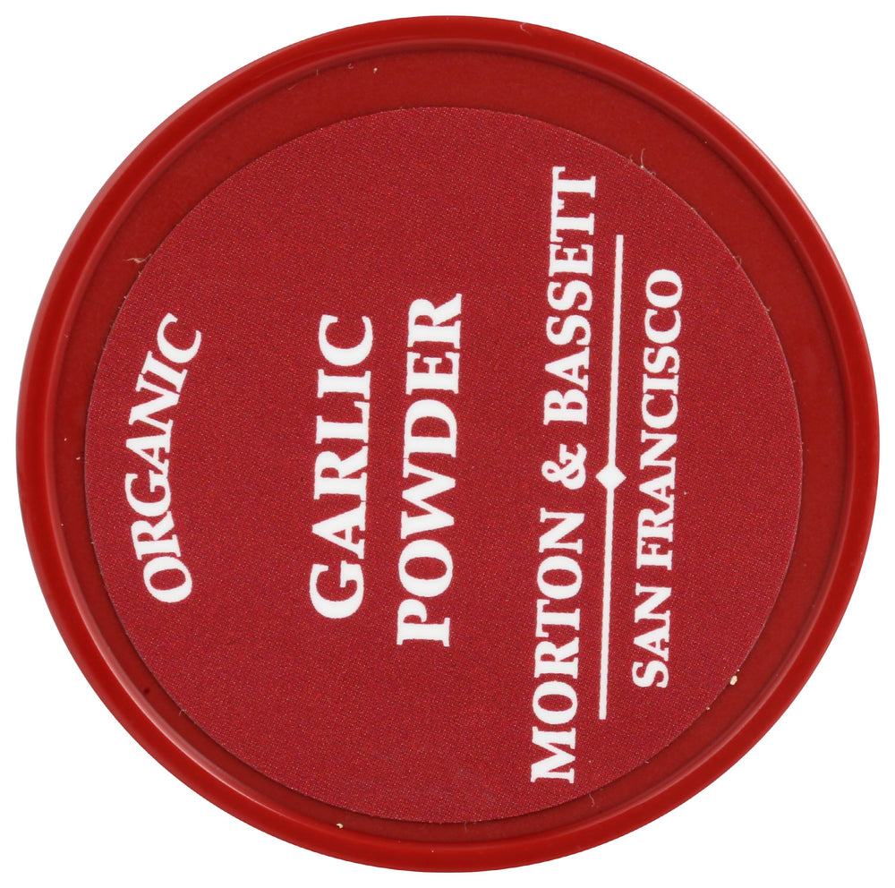 Measuring spoon with Morton and Bassett Organic Garlic Powder for quick seasoning