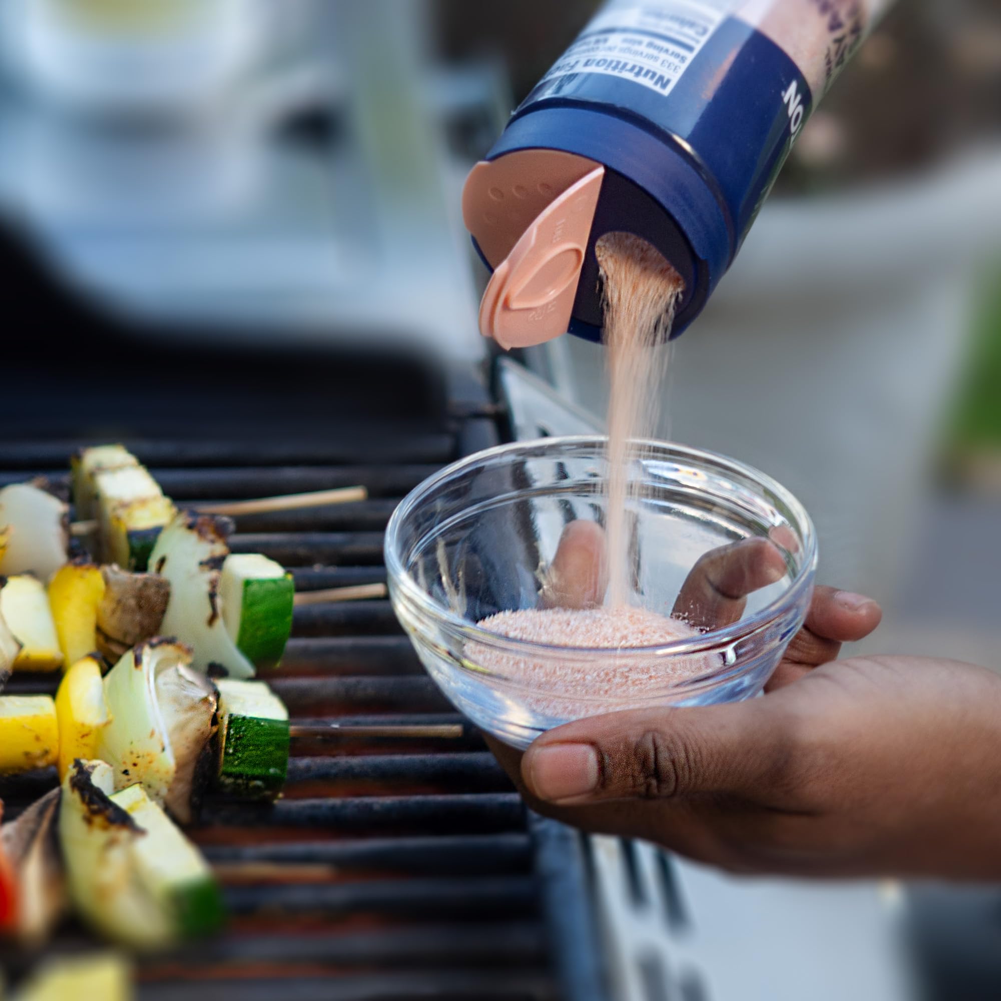 Morton salt shaker lid enabling easy shake, measure, or pour during cooking.
