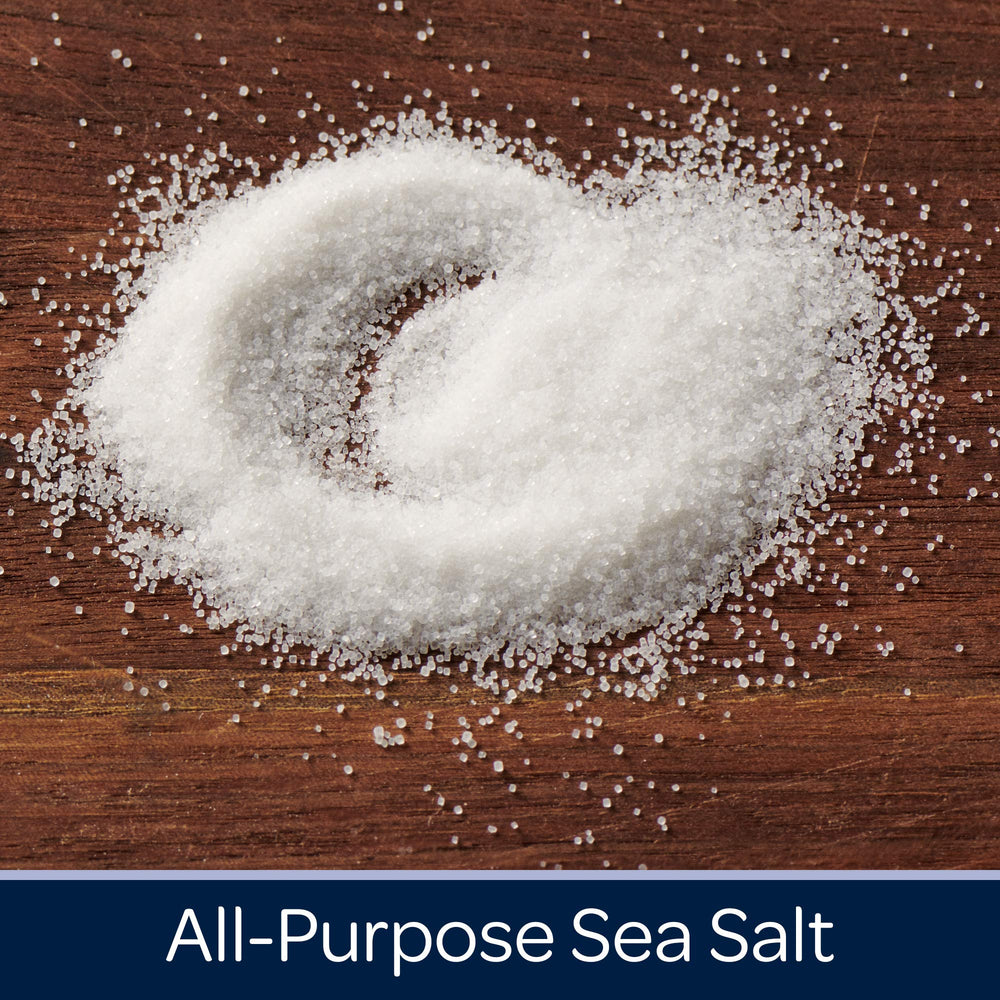 Morton iodized sea salt round being poured for dish seasoning