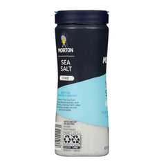 Pouring Morton Fine Sea Salt from a shaker to blend evenly in recipes