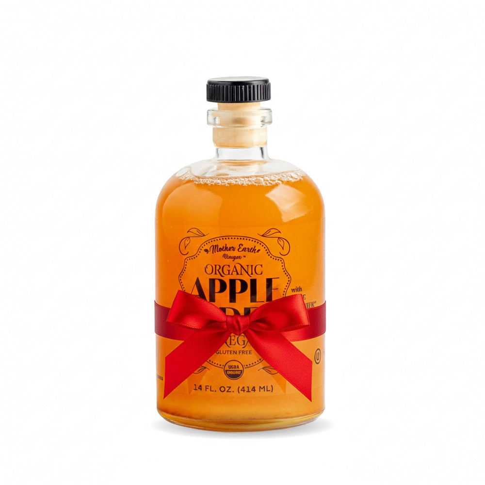 Mother Earth Vinegar bottle with pour spout for easy dressing and seasoning.