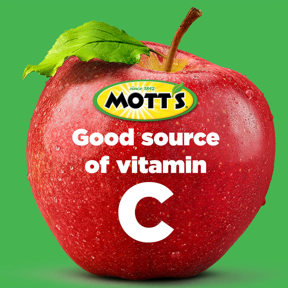 Mott's Cinnamon Applesauce being poured into a spoon.