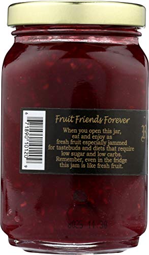 Close-up of Mountain Fruit Co Raspberry Tart Jam texture with fruit pieces.