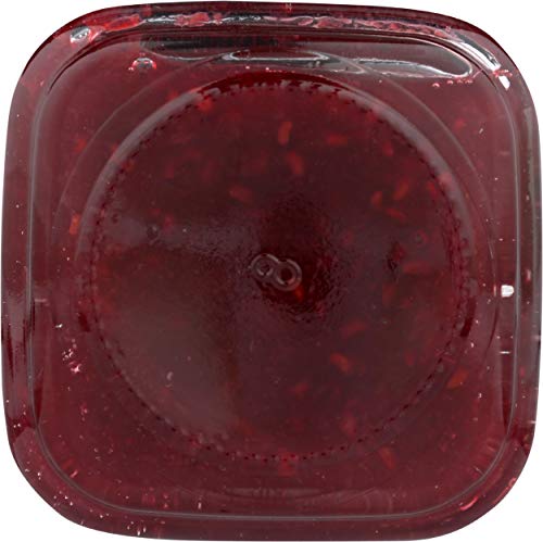 Spoonful of Mountain Fruit Co Raspberry Tart Jam in a yogurt bowl.