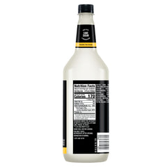 Mr & Mrs T Piña Colada Mix pouring into a glass for tropical flavor.