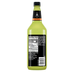 Mr & Mrs T Whiskey Sour Mix in a glass with a cocktail.