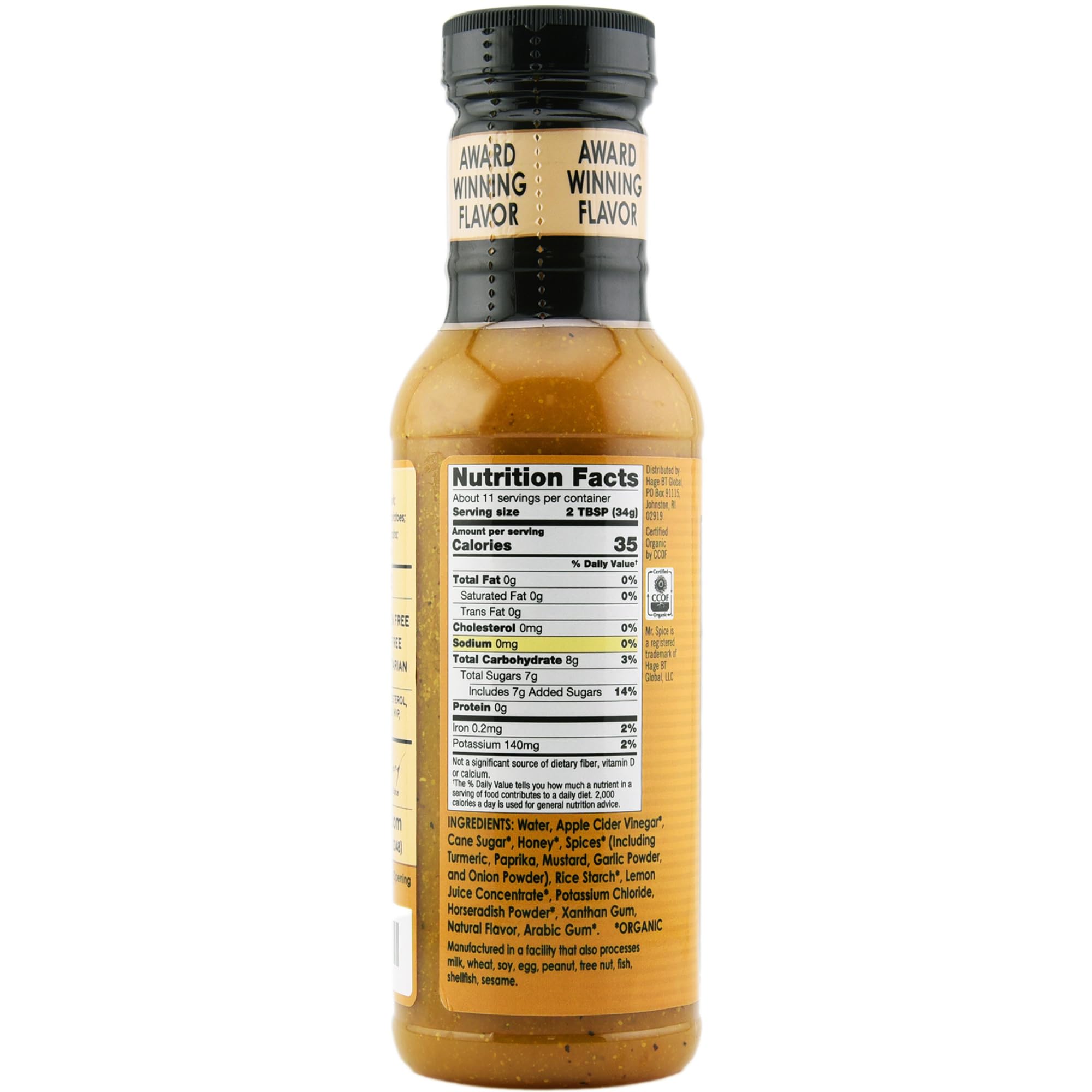 Mr. Spice Organic Honey Mustard Sauce bottle pouring a glaze on chicken.