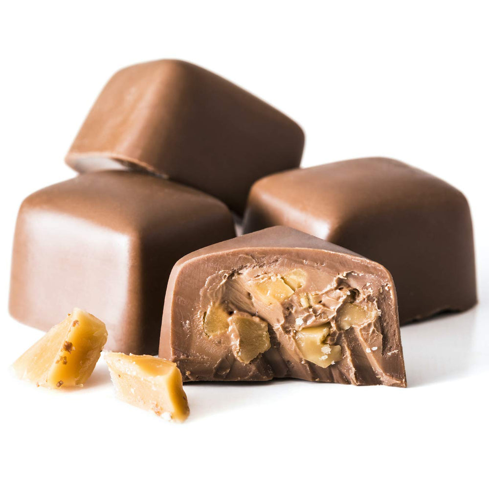 Close-up of smooth Belgian milk chocolate shell around a creamy toffee center for tasting.