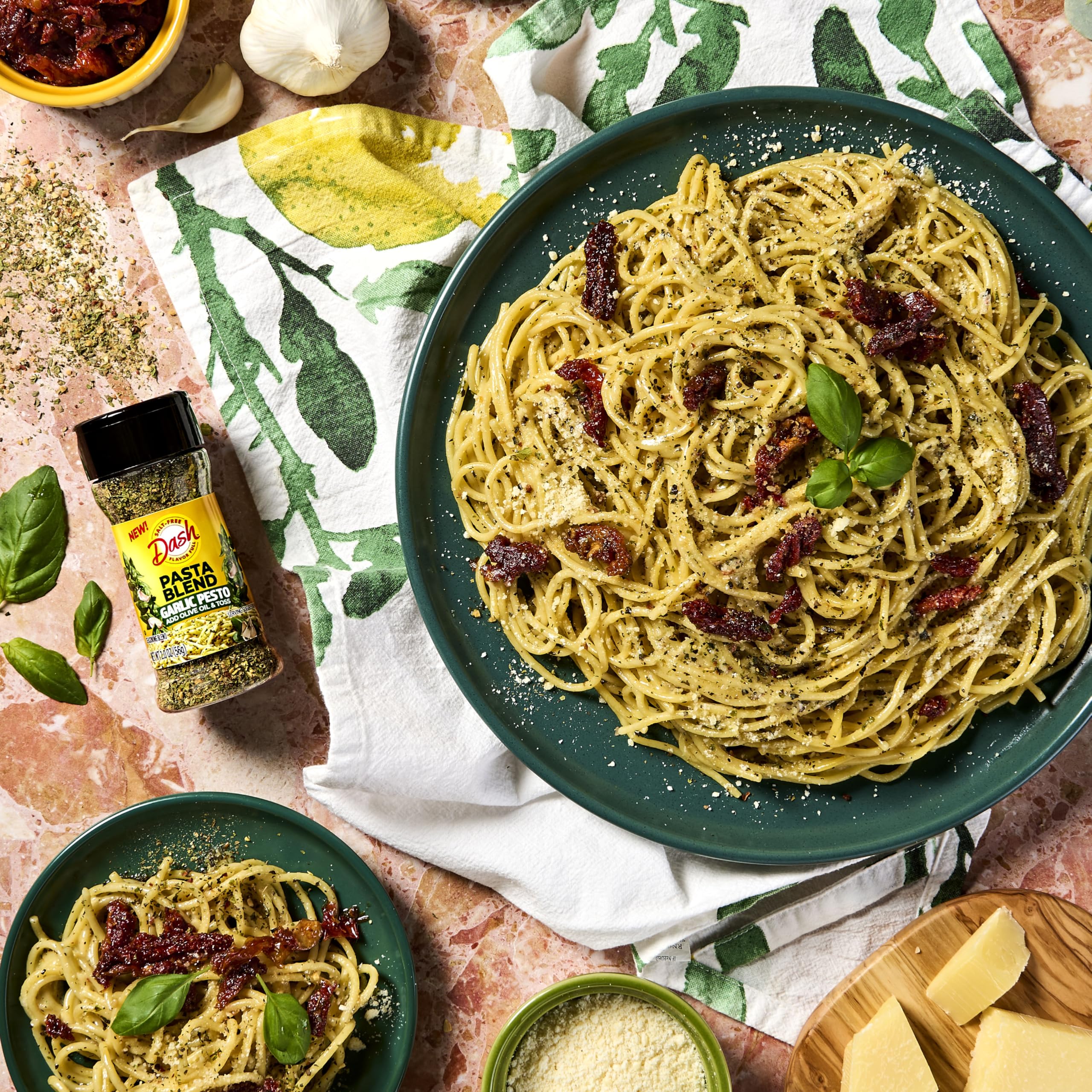 Mrs Dash Garlic Onion Flakes blend sprinkles over pasta for a quick flavor boost.