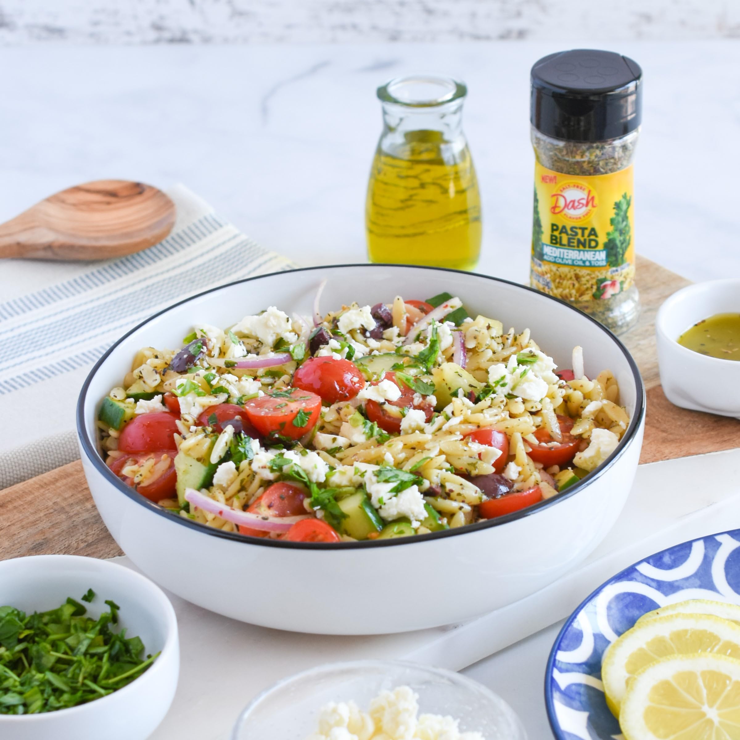Mrs. Dash pasta seasoning on kitchen counter ready for weeknight meals.